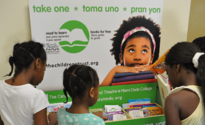 Young girls looking at books